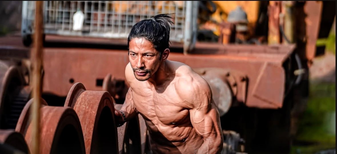 Coach Sujan displaying his competition physique